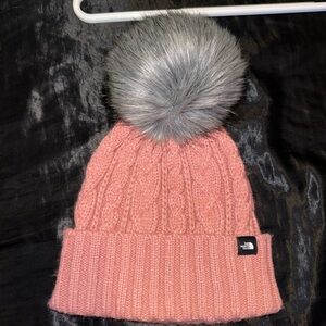 The North Face Dusty Pink Cable Knit Beanie with Gray Faux Fur Pom